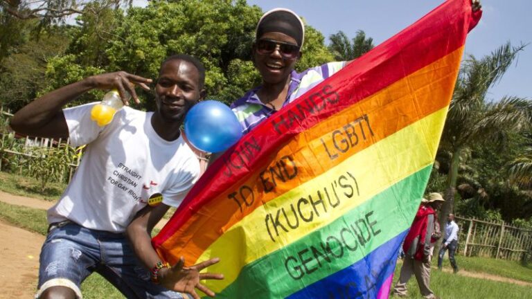 150805113605 Ugandan Men Rainbow Flag Entebbe.jpg