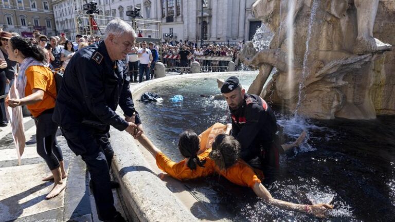 230507103156 Italy Climate Protest Fountain Black Restricted.jpg