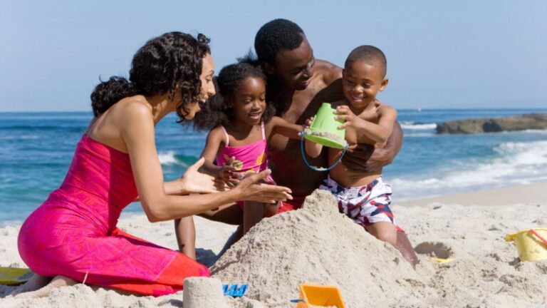 Family Making Sandcastle On The Beach.jpg