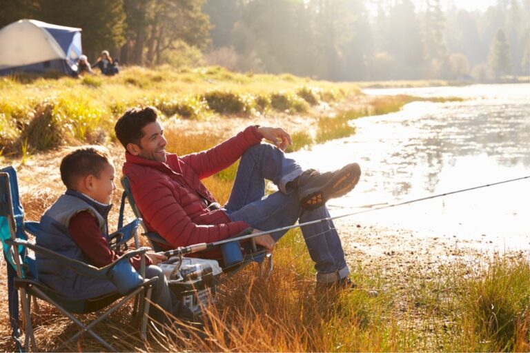 Father And Son On A Camping Trip Fishing By A Lake Picture Id540096342.jpg