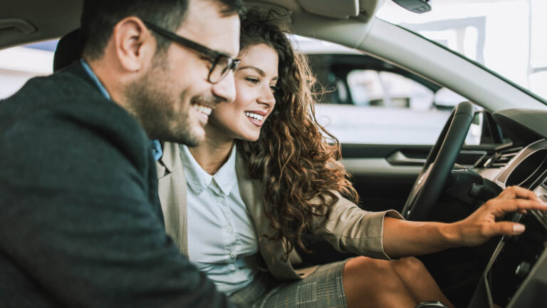 Couple Looking At Car In Dealership Istock 1170139775.jpg