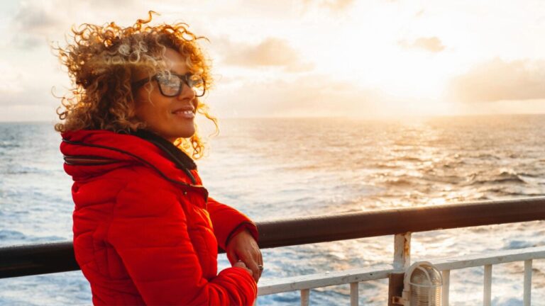 Cruise Ship Vacation Woman Enjoying Sunset Scaled E1703718166988.jpg