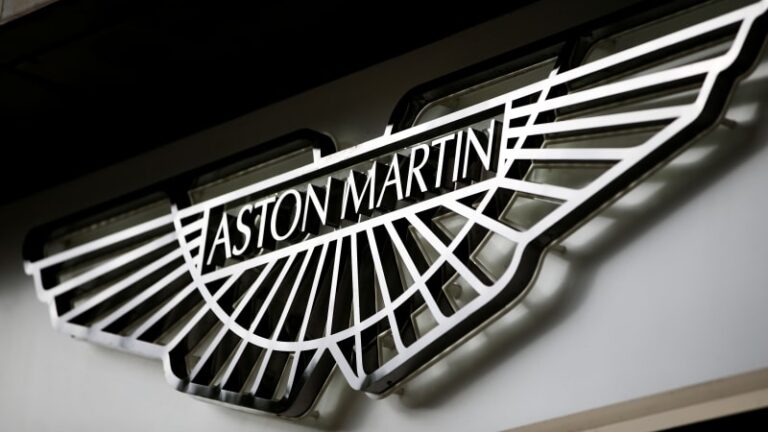 An Aston Martin Logo Is Seen On The Outside Of A Dealership In Central London.jpeg