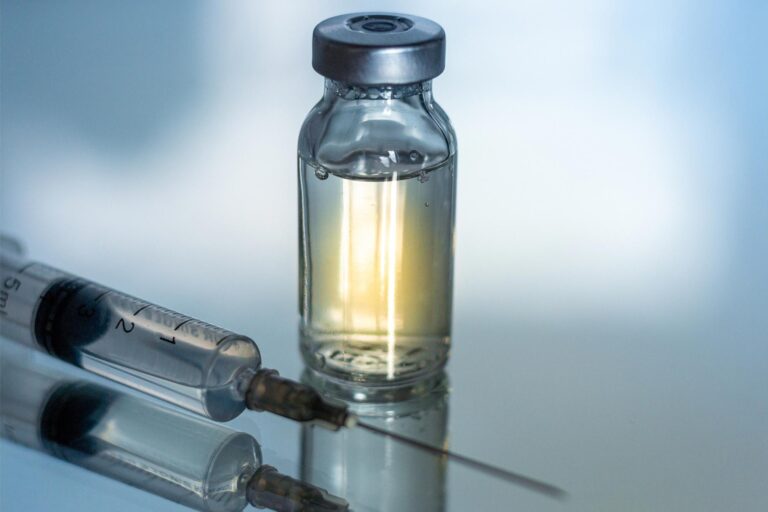 Vaccine Vial Needle Close Up.jpg