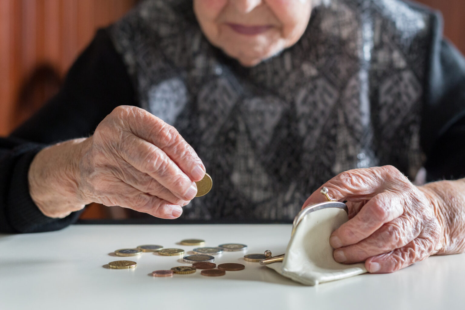 Elderly Person Counting Change.jpg