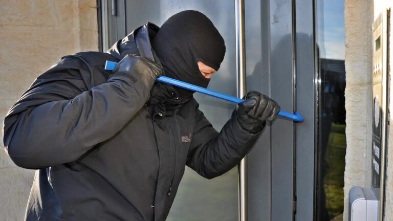 1 Is Your Home Being Targeted Burglar With Mask Breaking In With A Crowbar .jpg