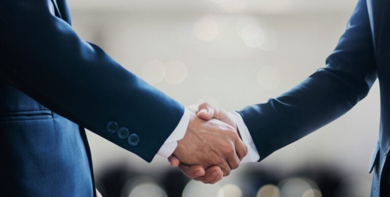 Handshake With Partner Canva 1024x517.jpg