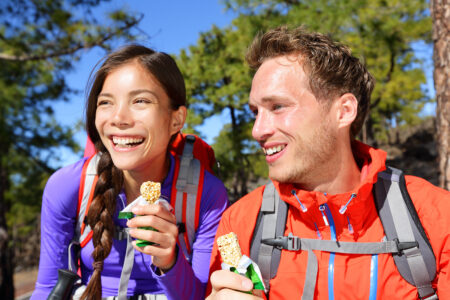 Bigstock Couple Eating Muesli Bar Hikin 74257219.jpg