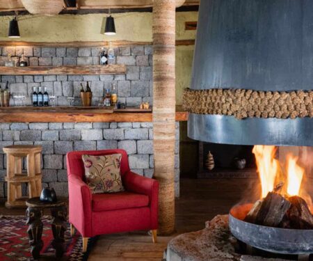 Volcanoes Safaris Virunga Lodge Bar Fireplace.jpg