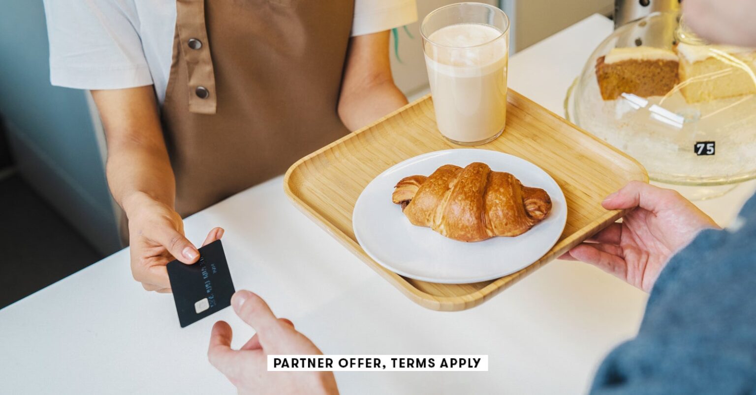 Social image partner offer terms apply customer paying for his order with a credit card in a cafe ic production 29.jpg