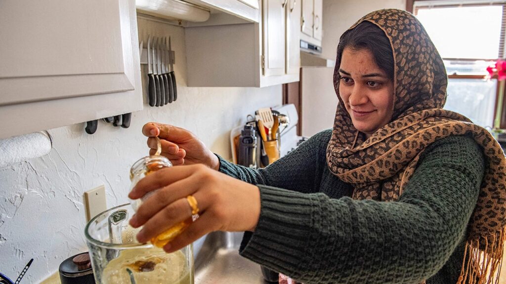 Afghan evacuee in mass.jpg